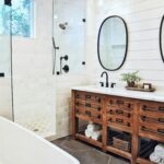 Modern farmhouse bathroom with a freestanding tub, rustic wood vanity, and minimalist decor, featured in 'Top 10 Bathtub Designs for 2024,' highlighting innovative bathtub trends.